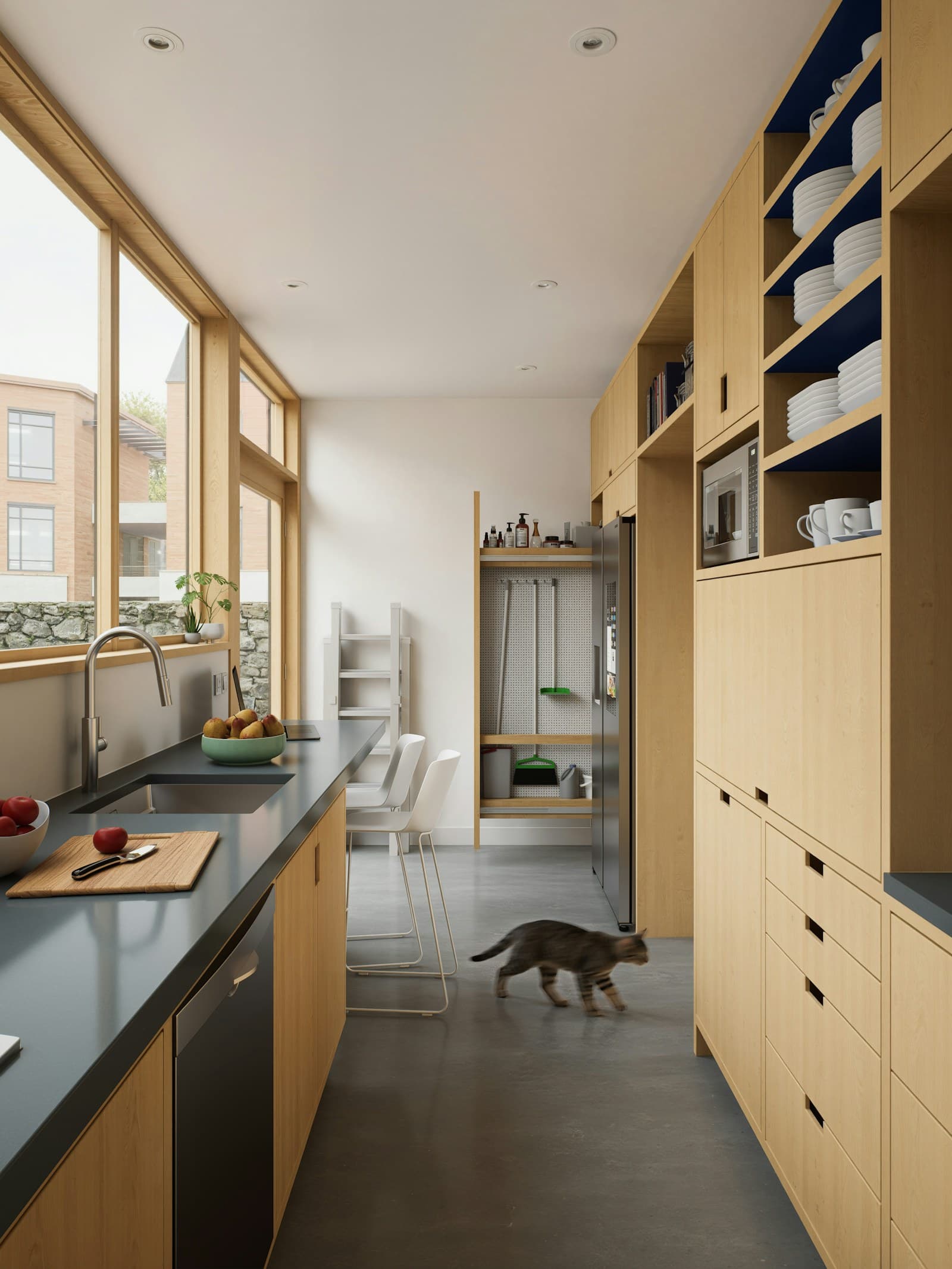 Kitchen in pale oak with light from the court windows